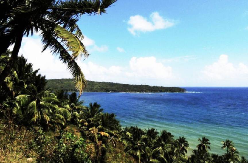 A couple snorkeling over coral reefs at North Bay Island